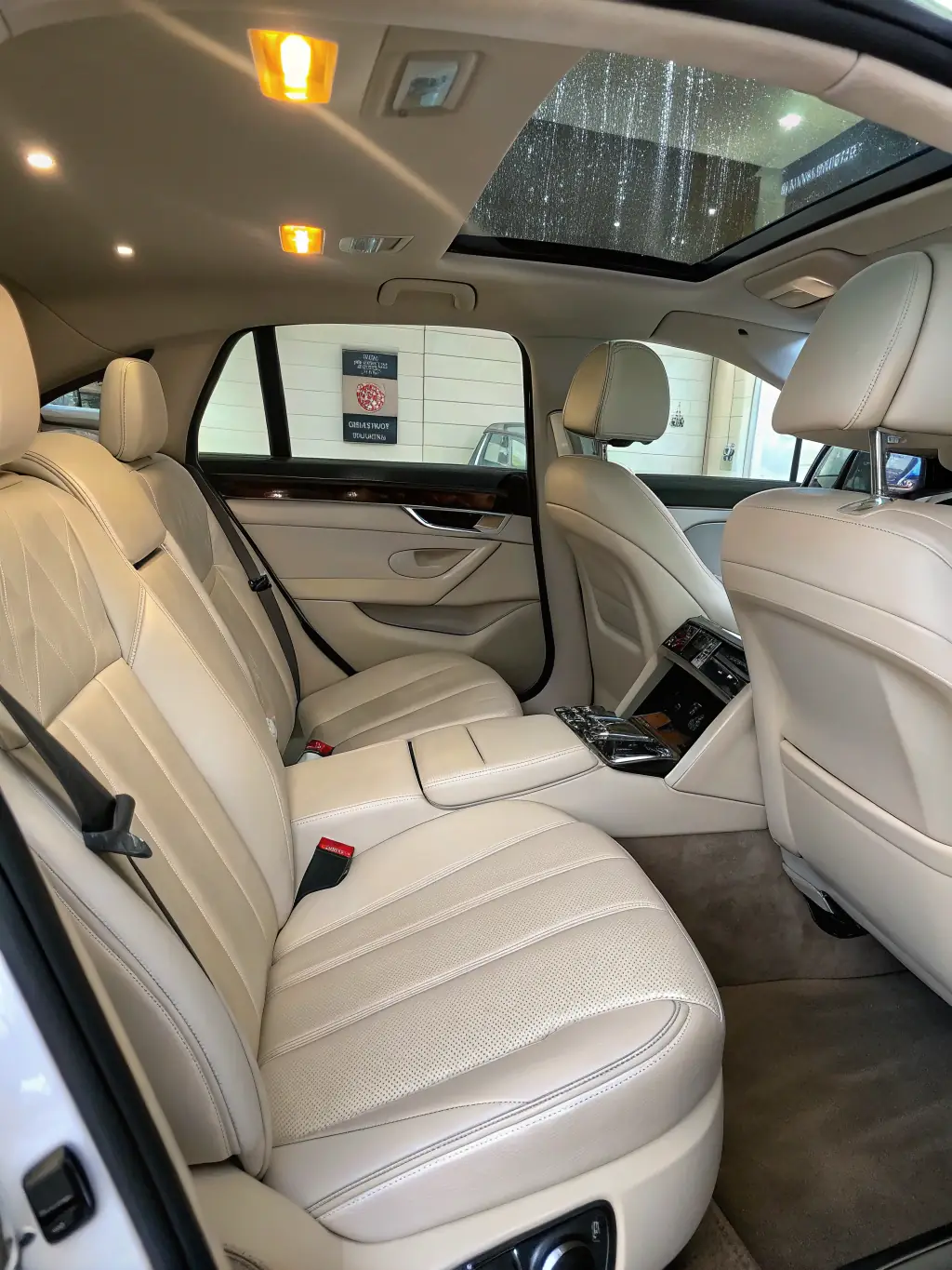 An interior shot of a car after a thorough detailing, focusing on the clean dashboard, spotless seats, and vacuumed carpets. The image highlights the attention to detail.